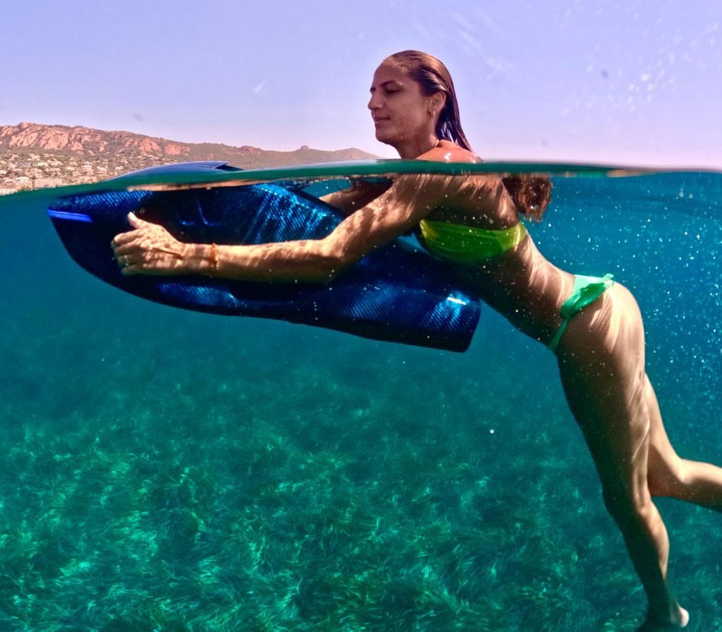Snorkeler using a SeaNXT sea scooter in open water
